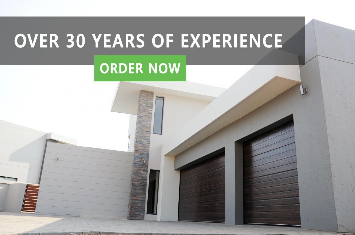 https://www.absolutedoors.co.za/wp-content/uploads/2019/04/home_garage_door.jpg